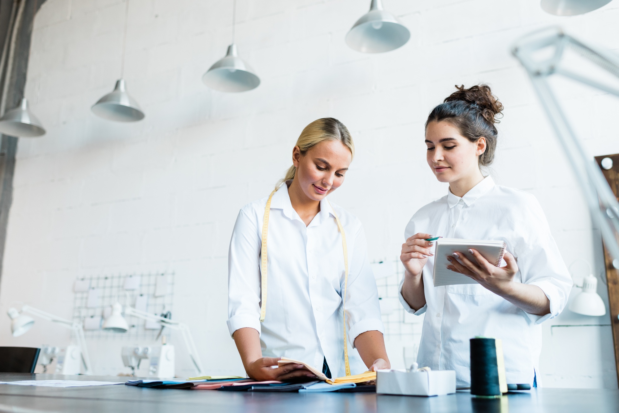 consultant reviewing kitchen workflow with chef